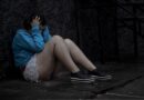 Girl holding her head while feeling stressed, representing mental health challenges and effective stress management.