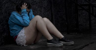 Girl holding her head while feeling stressed, representing mental health challenges and effective stress management.